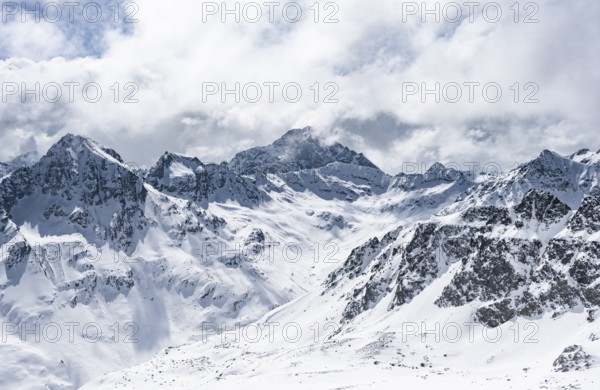 View at the summit of Piz Laviner, mountain panorama in winter, mountain landscape with mountain