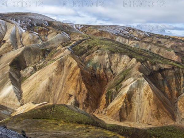 Early snow on the colorful rhyolite mountains, Landmannalaugar, Fjallabak Nature Reserve, Iceland,