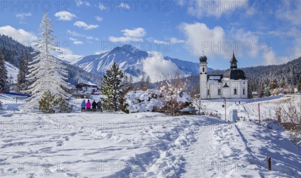 Seekirchl with artificial winter fir tree and Hocheder 2797m in winter, Seefeld, Seefeld Plateau,