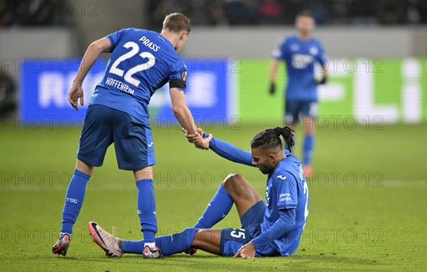 Alexander Prass TSG 1899 Hoffenheim (22) helps Kevin Akpoguma TSG 1899 Hoffenheim (25) to his feet,
