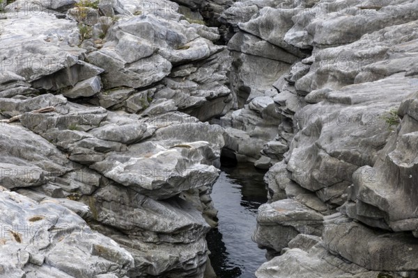 Rocks, granite rock formations in the Maggia River near Ponte Brolla, in the Maggia Valley, Valle