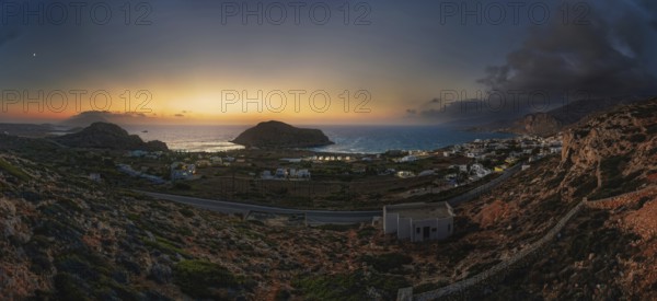 Atmospheric dusk with a view of the coast and town of Arkasa and the sea in the background, Arkasa,