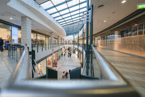 Elongated aisle in a modern shopping centre under a glass roof, Sterncenter Sindelfingen, Böblingen