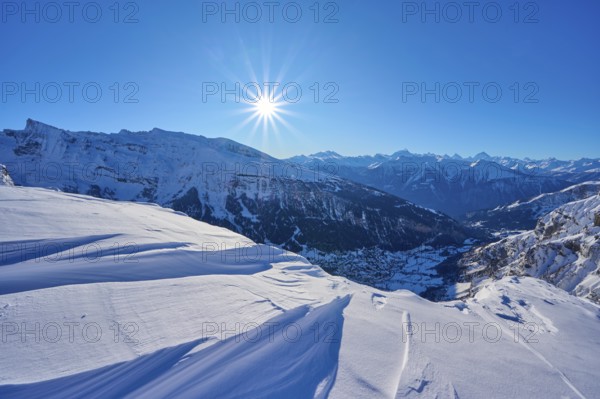 Snowy mountain landscape under a clear blue sky with bright sunshine, Gemmi Pass, Leukerbad, Leuk,