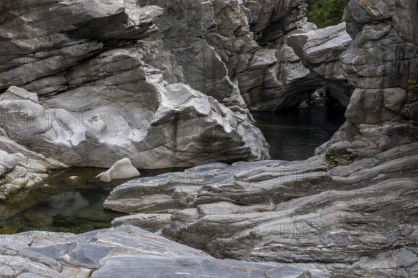 Rocks, granite rock formations in the Maggia River near Ponte Brolla, in the Maggia Valley, Valle