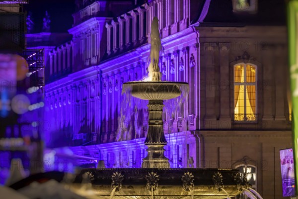 Court of honour on Schlossplatz. The New Palace and fountain are illuminated. Stuttgart,