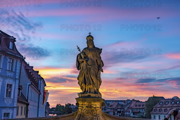 Statue of Empress Cunegonde on the Lower Bridge in Bamberg at sunset, Upper Franconia, Bavaria,