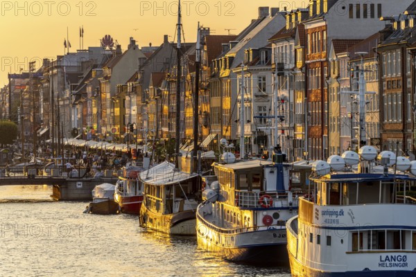 Colourful houses, restaurants and historic ships on the Nyhavn canal and harbour, Copenhagen,