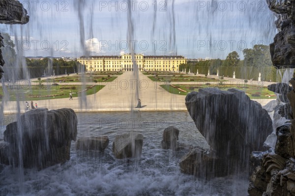 View through the Neptune Fountain to Schönbrunn Park and Palace, UNESCO World Heritage Site in