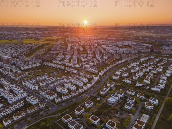 The sun rises over the Riedberg district of Frankfurt. (Aerial view with a drone), Riedberg,