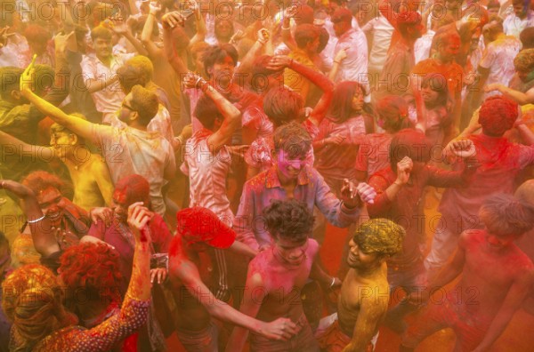 Revellers smear with Gulal or coloured powder and dance to play Holi, the Hindu spring festival of