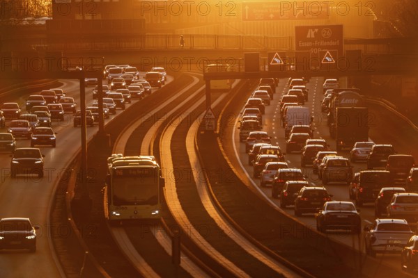Motorway A40, dense, slow-moving traffic jam, evening traffic at the Essen-Kray junction, low sun,