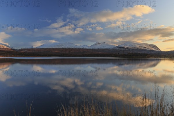 Mountains reflected in lake, autumn colours, sunny, evening light, Lapporten, Abisko National Park,