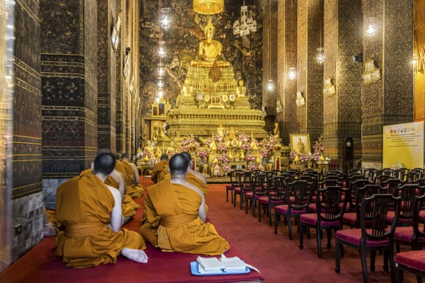 Wat Pho temple in Bangkok near the Grand Palace. Buddhist monks during a religious ceremony.