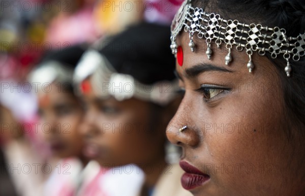 Girls from tea tribe community wait to perform traditional Jhumur dance, on the eve of 'Jhumoir