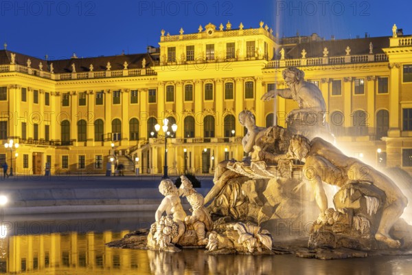 Fountain in the courtyard of honour at Schönbrunn Palace at dusk, UNESCO World Heritage Site in