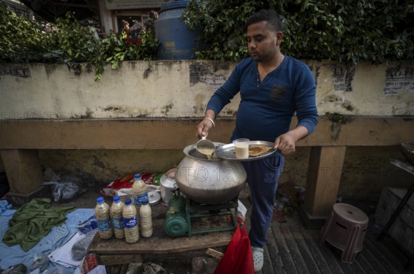 A street vendor sells Ghota, a cannabis-based drink, on the occasion of Maha Shivaratri, on the