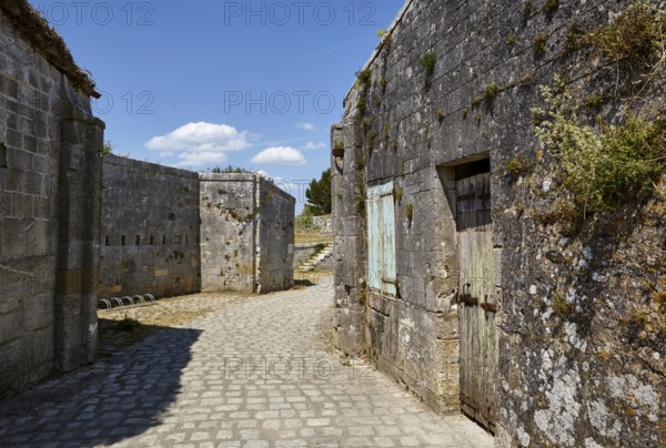 Walls of old fortifications and a cobblestone path on the island of Île-d'Aix, Charente-Maritime,