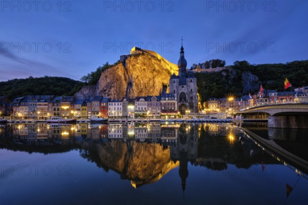 Night view of Dinant town, Collegiate Church of Notre Dame de Dinant over River Meuse and Pont