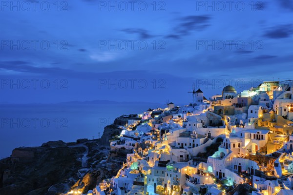 Famous greek iconic picturesque tourist destination Oia village with traditional white houses and