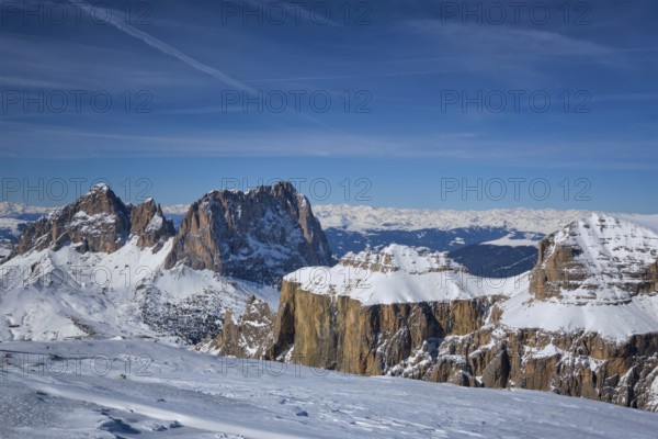 View of a ski resort piste and Dolomites mountains in Italy from Passo Pordoi pass. Arabba, Italy,