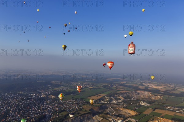 Many different hot air balloons in the blue sky, advertising, logo, hot air balloon festival, 26th