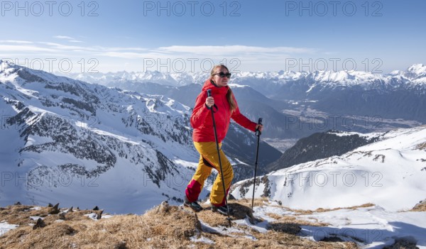 Ski tourers at the summit of the Mitterzeigerkogel in winter, Sellraintal, Kühtai, Tyrol, Austria,