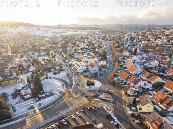 Winter city view with snow-covered streets and a roundabout, Calw- Stammheim, Black Forest,