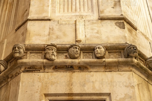 Famous heads on the façade of the Cathedral of St James, UNESCO World Heritage Site in Sibenik,