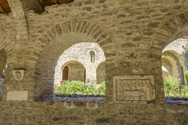 Tomb panels and inner courtyard at the cloister of Saint Martin du Canigou Abbey, Casteil,
