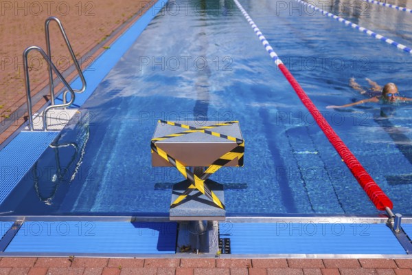 Hagen, North Rhine-Westphalia, Germany - Blocked-off starting block at the edge of the swimming