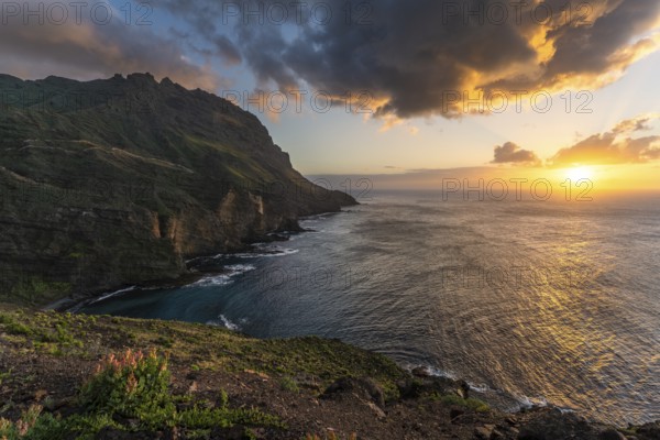 Landscape near Alojera with sea, coast, cliffs and mountains at sunset. Alojera, La Gomera, Canary