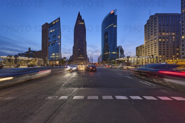 Vehicles with motion blur and light traces, skyscrapers Forum Tower, Kollhoff Tower and railway