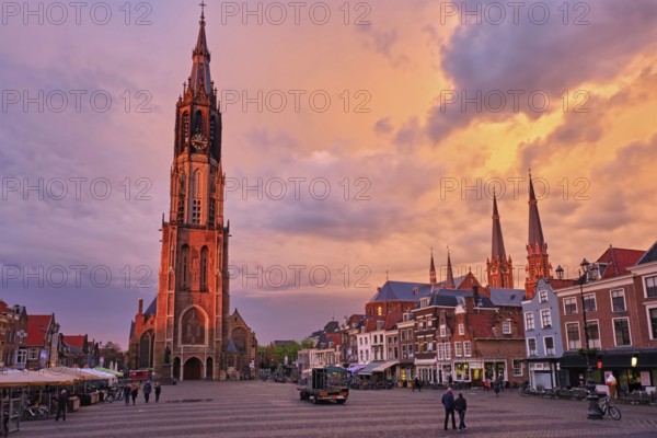 Nieuwe Kerk New Church protestant church on Delft Market Square Markt with dramatic sky on sunset.