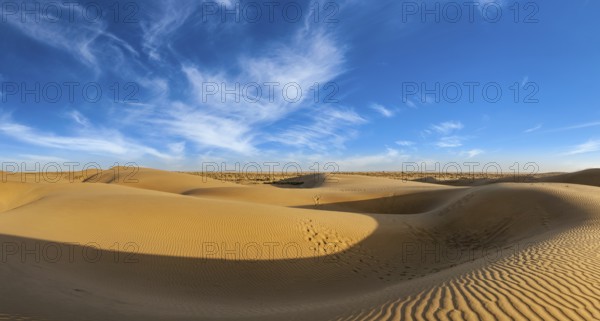 Panorama of dunes landscape with dramatic clouds in Thar Desert. Sam Sand dunes, Rajasthan, India,