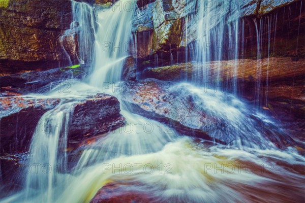 Vintage retro effect filtered hipster style image of tropical waterfall. Popokvil Waterfall, Bokor