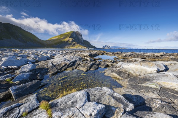 Rocky coast and mountains of the island of Værøy, Vaeroy, Lofoten, Norway, Europe