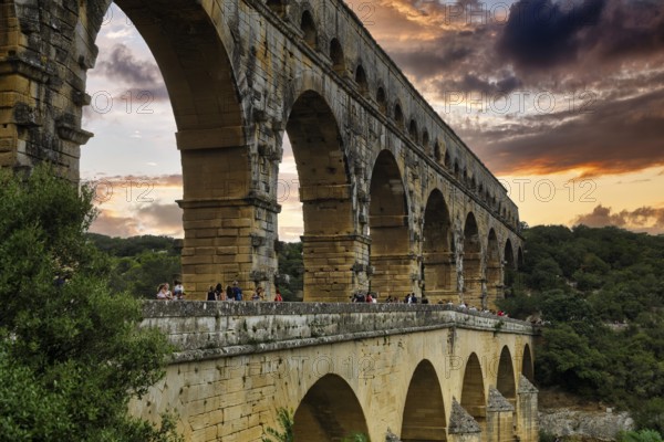 Pont du Gard, Roman aqueduct over the river Gardon, evening sky, Languedoc-Roussillon, South of