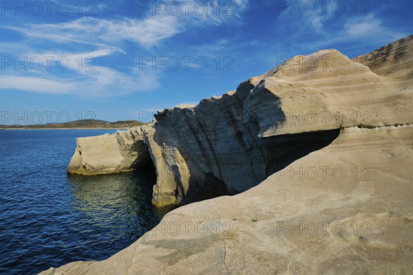 White rocks of famous tourist attraction of Milos island Sarakiniko beach and Aegean sea, Milos