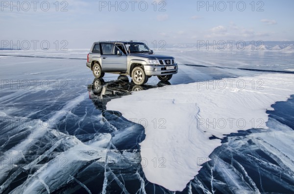 Car on the ice of Lake Baikal, Olkhon Island, Pribaikalsky National Park, Irkutsk Province,