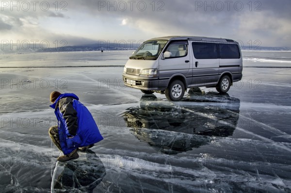 Car on the ice, Lake Baikal, Olkhon Island, Pribaikalsky National Park, Irkutsk Province, Siberia,