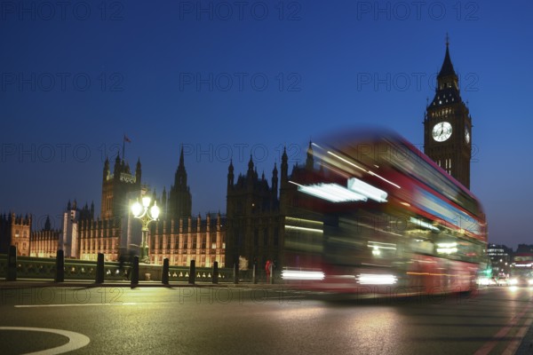 Red double-decker bus on Westminster Bridge, blue hour, Big Ben in the background, Westminster,