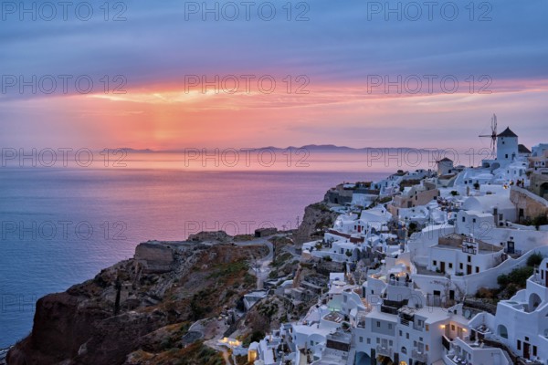 Famous greek iconic selfie spot tourist destination Oia village with traditional white houses and