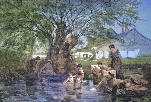 A rural washing place by the river, woman washing clothes and the children bathing in the river,