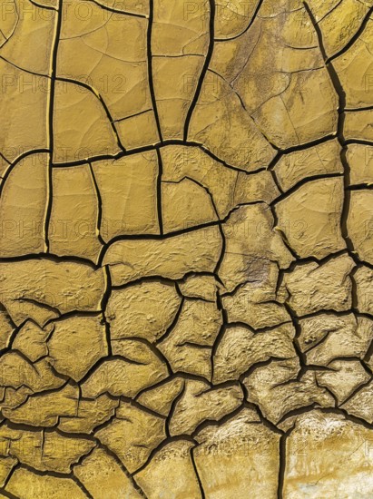 Mineral-rich cracked earth at the bank of the Rio Tinto (Red river), aerial view, drone shot,