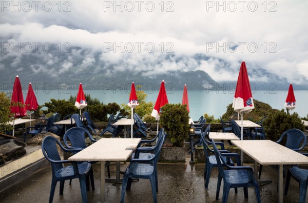 Empty restaurant, café, bad weather on the lake promenade at Lake Brienz, Brienz, Canton Bern,