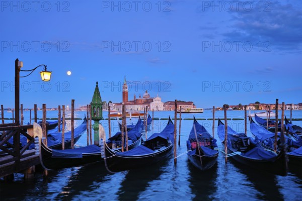 Romantic vacation Venice travel background, gondolas at Saint Mark (San Marco) square and Basilica