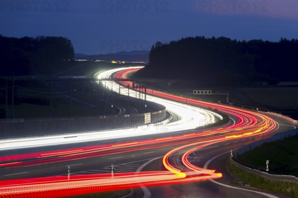 Tracers on the A8 motorway, winding road, evening, long exposure, Swabian Alb, Baden-Württemberg,