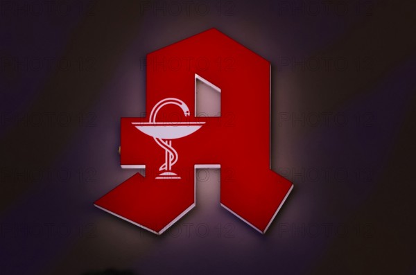 Night shot, logo, red neon sign, pharmacy sign with Aesculapian staff, Aesculapian staff,
