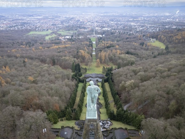 Copper statue of Hercules in Bergpark Wilhelmshöhe with a view over Wilhelmshöhe Palace and